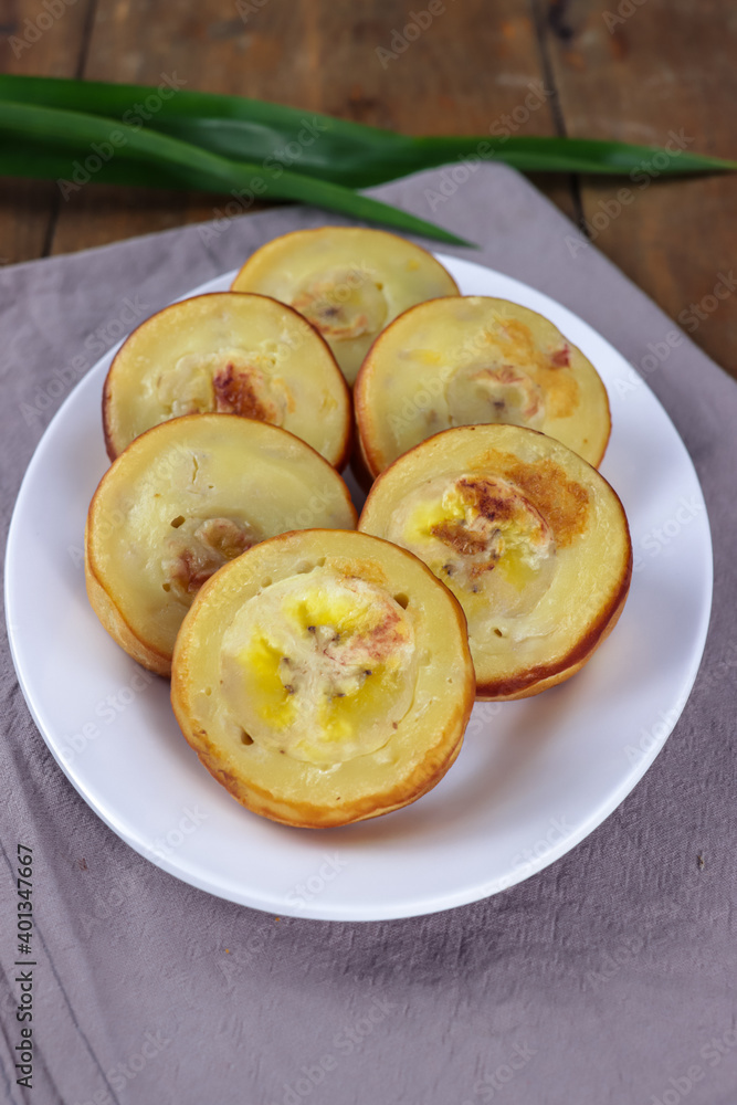 Roti Pisang Banjar, Indonesian traditional pancake from Banjarmasin, South Kalimanta, made from banana, egg, flour and coconut milk Roti Pisang Banjar, Indonesian traditional pancake from Banjarmasin, South Kalimanta, made from banana, egg, flour and coconut milk