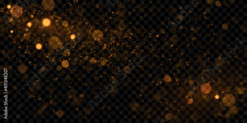Gold bokeh light effect. Glowing particles isolated on dark transparent background.