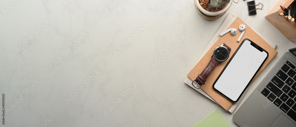 Naklejka premium Workspace with smartphone, laptop, stationery, accessories and copy space