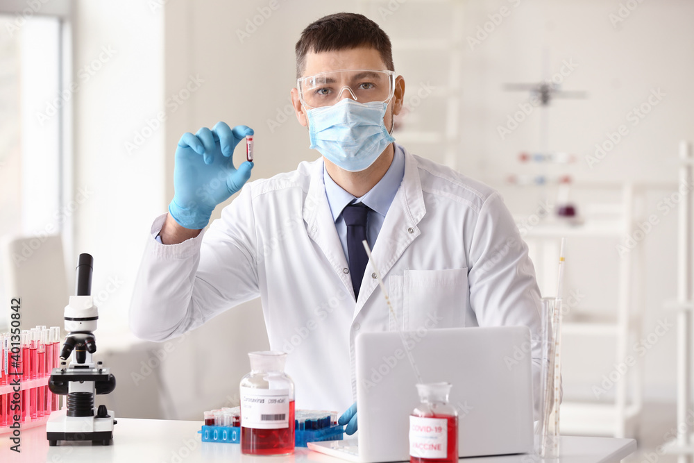 Scientist developing covid-19 vaccine in laboratory Scientist developing covid-19 vaccine in laboratory