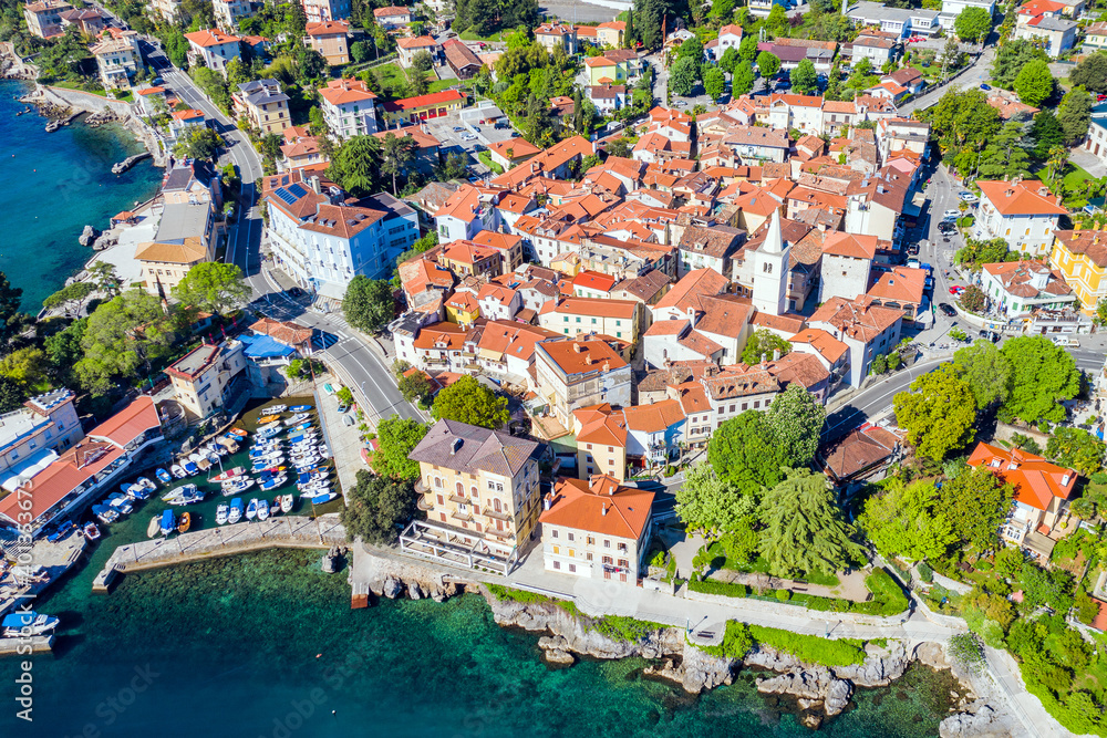 Aerial view of beautiful old town of Lovran in Croatia, historic center and coastline