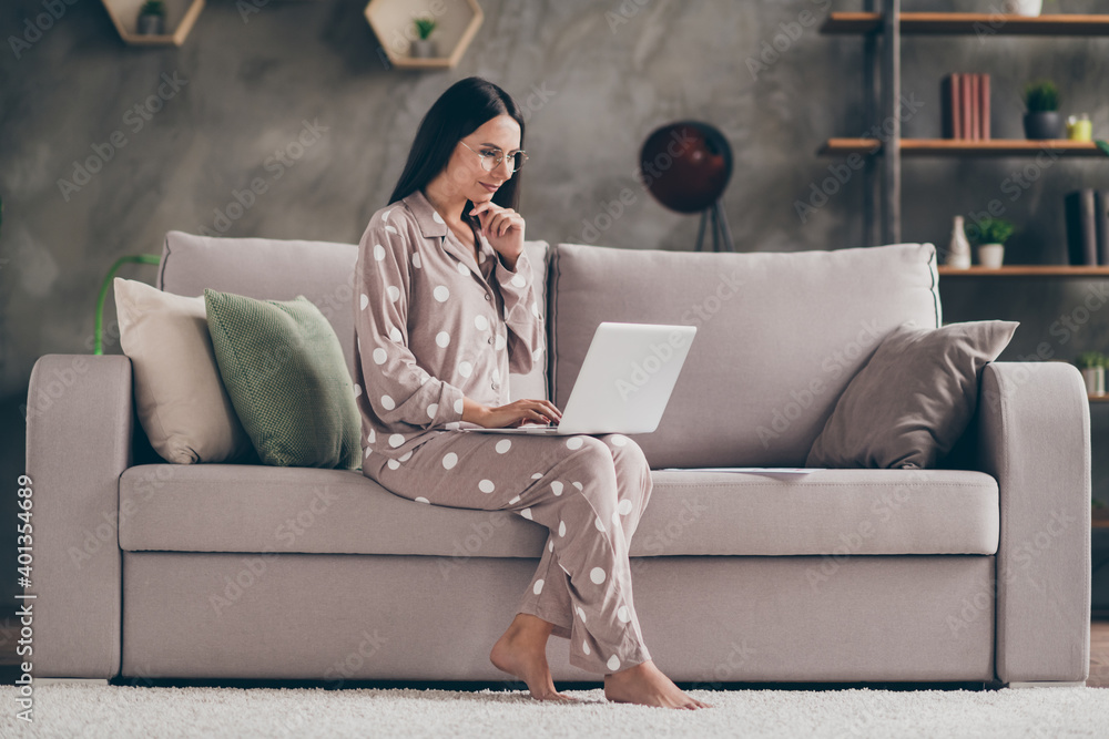 Profile photo of nice optimistic girl fist face sit write laptop wear  spectacles pijama at home on sofa Stock Photo | Adobe Stock