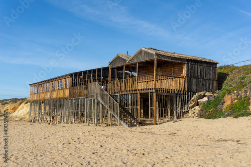 view of the "A Choupana" beachfront restaurant at the Praia do Farol beach in Milfontes © makasana photo