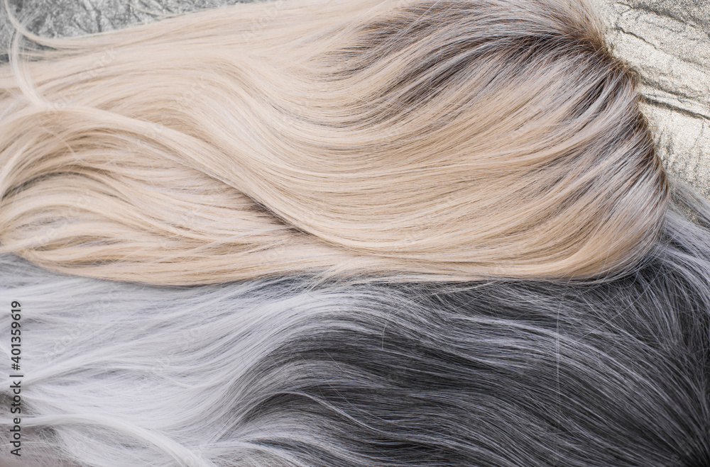Fototapeta premium Wigs, natural and synthetic hair. Women's beauty concept. Close up photo of wig, hair for ladies