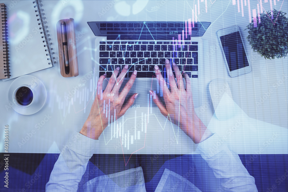 Double exposure of woman hands working on computer and forex chart hologram drawing. Top View. Financial analysis concept. Double exposure of woman hands working on computer and forex chart hologram drawing. Top View. Financial analysis concept.