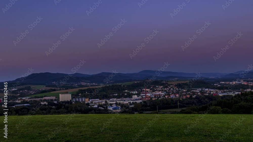 Timelapse of a changing cloudless sky in the town of Valasske Mezirici with a view of the landscape and the surrounding hills, dark clouds are slowly turning into darkness. Timelapse of a changing cloudless sky in the town of Valasske Mezirici with a view of the landscape and the surrounding hills, dark clouds are slowly turning into darkness.