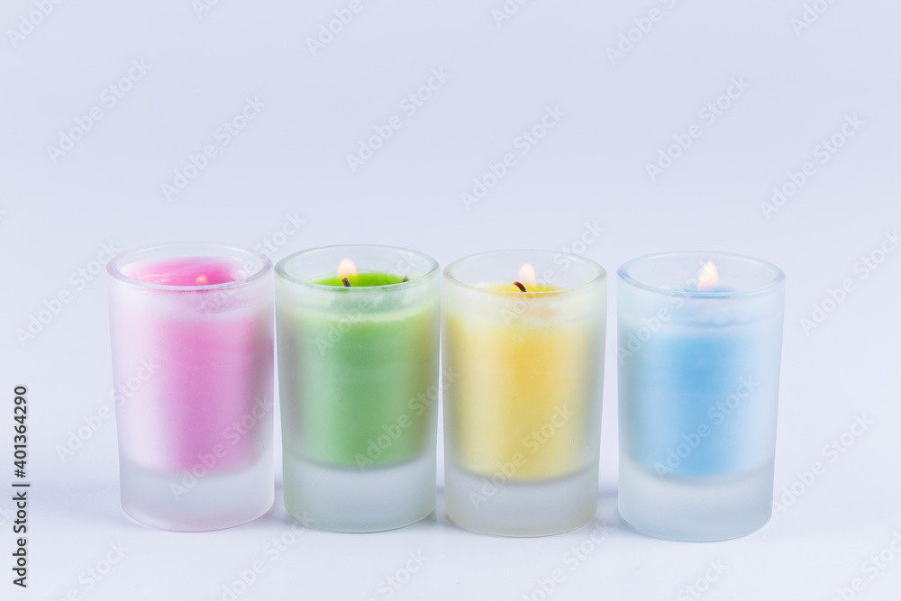 close up view of colorful candles over white background close up view of colorful candles over white background