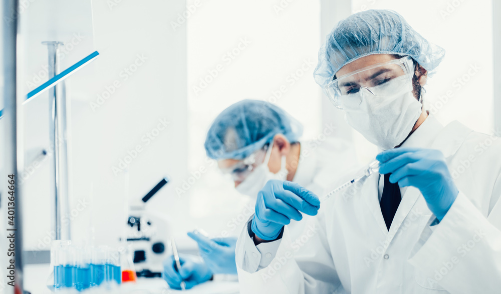 close up. group of scientists sitting at a laboratory table. close up. group of scientists sitting at a laboratory table.