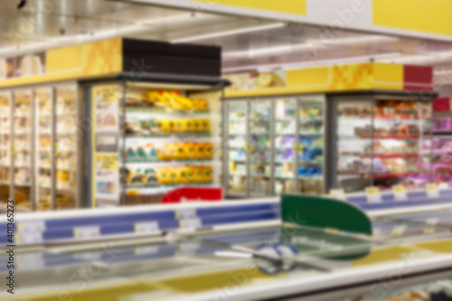 Interior of a large light supermarket. Blurred. © Анна Демидова