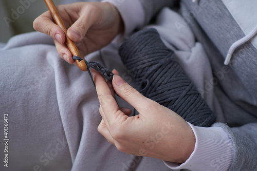 close-up of female hands knitting crochet. Photo of handwork