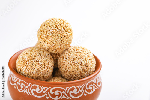 Indian sweet for traditional festival makar sankranti :Rajgira laddu made from Amaranth seed in Bowl on white background