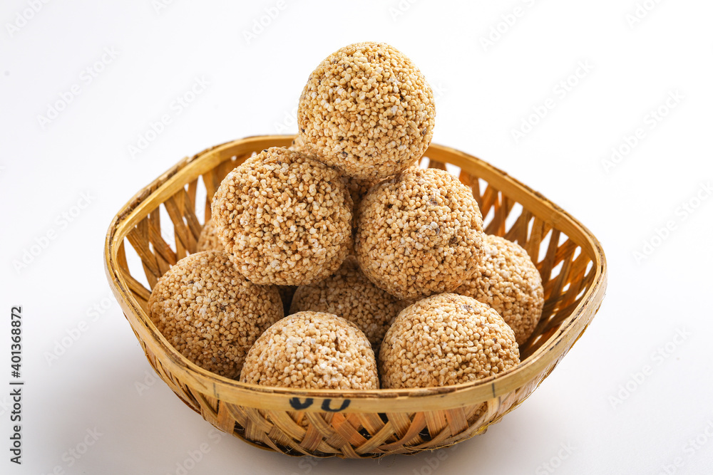 Indian sweet for traditional festival makar sankranti :Rajgira laddu made from Amaranth seed in Bowl on white background Indian sweet for traditional festival makar sankranti :Rajgira laddu made from Amaranth seed in Bowl on white background