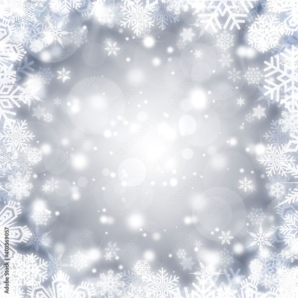 Festive silver bokeh background with a frame of shiny white snowflakes Festive silver bokeh background with a frame of shiny white snowflakes