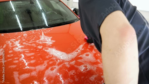 Close up to PPF installation process on a front rear headlight and bamper. PPF is a Paint Protection Film which protect paint