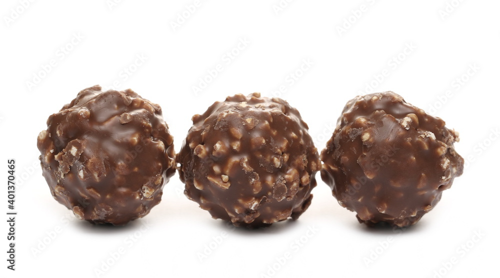 Round hazelnut chocolates isolated on white background Round hazelnut chocolates isolated on white background