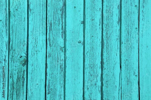 wood planks covered with rubbed blue paint