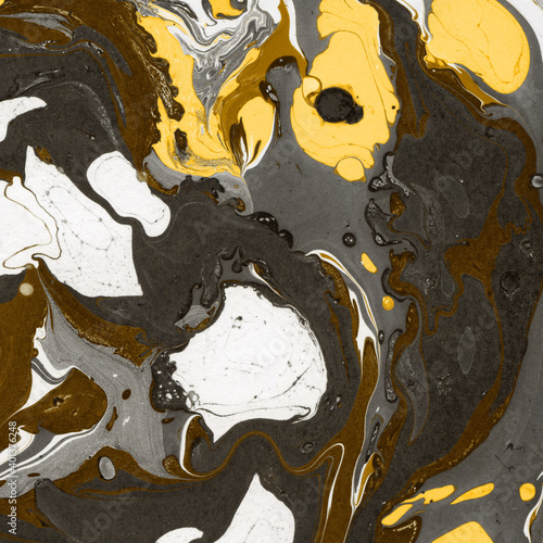 Gold luxury marble ink texture on watercolor paper background. Marble stone image. Bath bomb effect. Psychedelic biomorphic art.