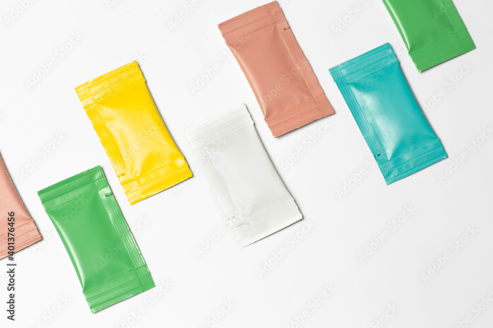 Close-up composition of colored sachets on a white background. Close-up composition of colored sachets on a white background.