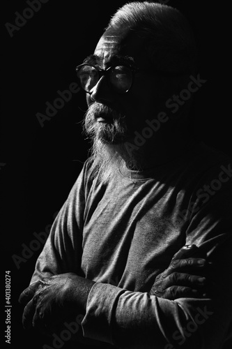 asian senior man with gray beard and mustache wearing eyeglasses