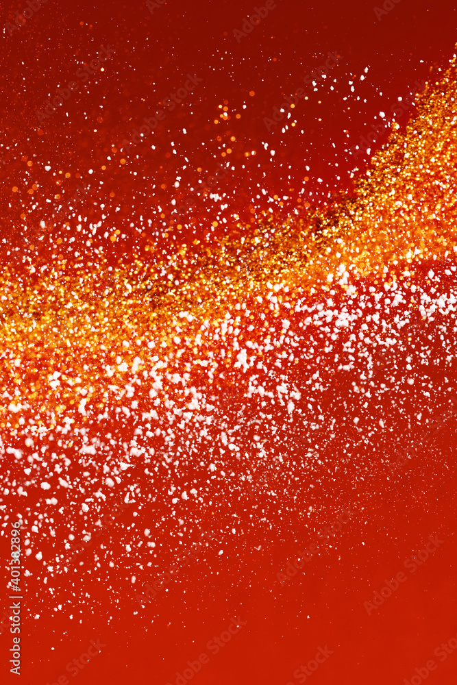Festive red background with golden glitter and snow, decoration for Chinese New Year