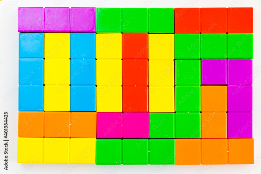 Colorful puzzle cubes background, geometric figures, table game