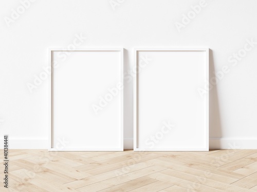 Fototapeta Naklejka Na Ścianę i Meble -  Two blank vertically oriented rectangular exhibition backgrounds with white border standing on wooden floor. 3D Illustration.