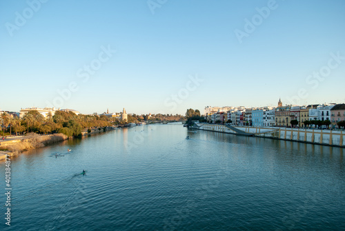 the Guadalquivir river runs through the beautiful Seville in Andalusia © corradobarattaphotos