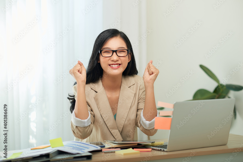 Asian woman working and drink coffee at home happy with success job Asian woman working and drink coffee at home happy with success job