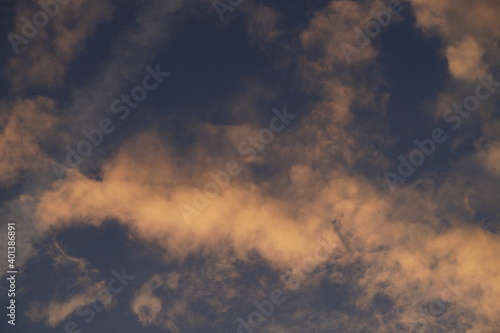 Deep blue sky with bright orange clouds