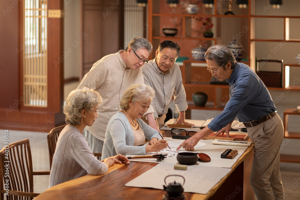 Happy friends drawing Chinese painting together Happy friends drawing Chinese painting together