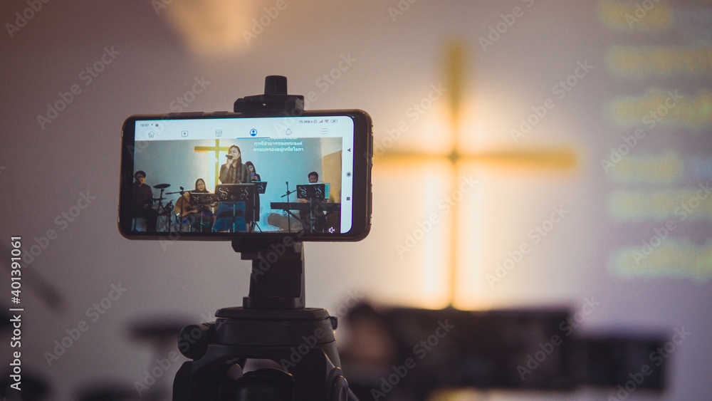 Church services online with new normal concept, Live worship with smartphone. Church services online with new normal concept, Live worship with smartphone.