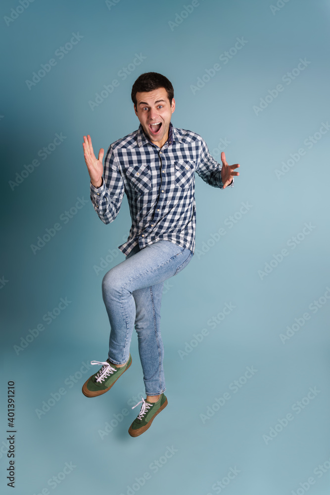 Happy young casual man jumping Happy young casual man jumping