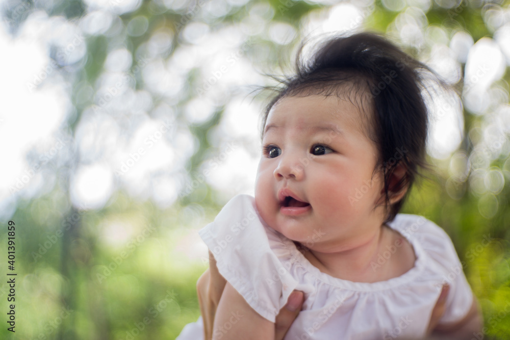 Asian woman in white dress and her baby playing happiness in the park , outdoor ,mother day concept. Asian woman in white dress and her baby playing happiness in the park , outdoor ,mother day concept.