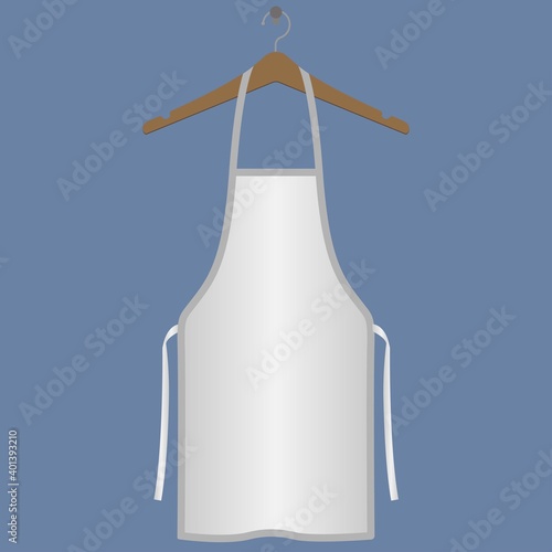 White apron on a wooden hanger