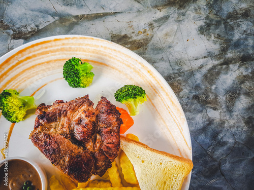 The arrangement of the steak on the plate