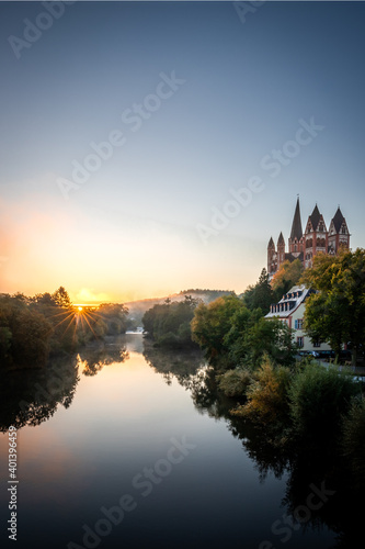 Limburg an der Lahn, for the sunrise, The cathedral in Limburg on the river Lahn with lots of nature and trees. reflection