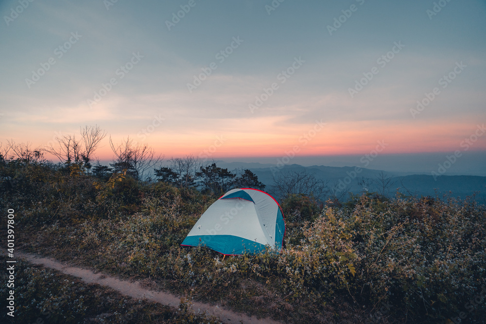 Pitch a tent on the mountain in the evening