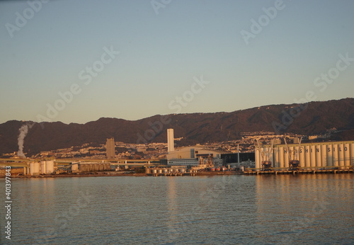 Panoramic view of Large industrial port with sunrise at Kobe port and heavy industrial factory, Hyogo, Japan - 神戸港とターミナル 日の出 photo