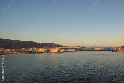 Panoramic view of Akashi Kaikyo Bridge with Sunrise at Kobe Port in Hyogo  Japan -                                         