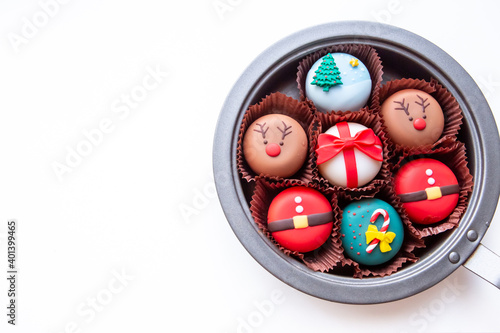Christmas-themed cake in trays to give a special gift to a happy Christmas season, isolated on white background.