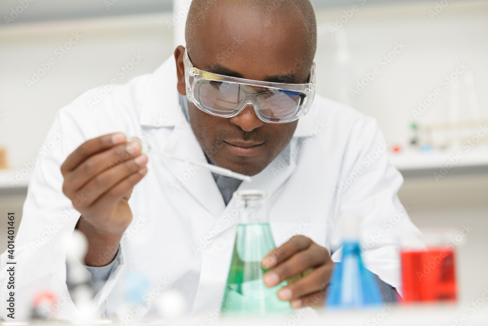 chemist man use micro pipette chemist man use micro pipette
