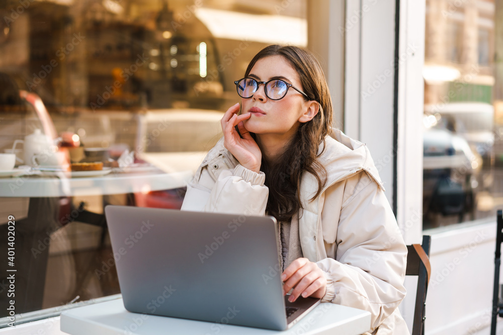 Smiling young woman using laptop Smiling young woman using laptop