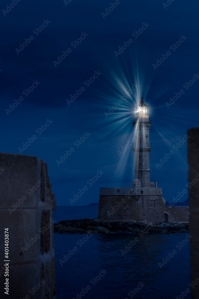 Lighthouse during a dark winter night, in Chania town, Crete island, Greece, Europe
