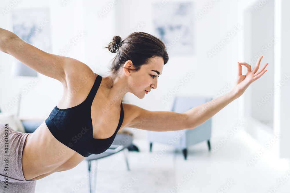 Tranquil Caucasian female in activewear relaxing in Natarajasana keeping healthy lifestyle and wellness, flexible woman enjoying sport and yoga training perfect body shape for mindfulness vitality