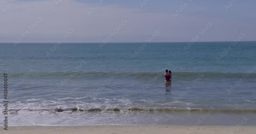 A mother and daughter enjoy a Mexican beach A mother and daughter enjoy a Mexican beach