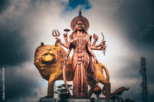 Asian Hindu statue in Mauritius and Bali. Gods temple and water. Worship operas and religion  