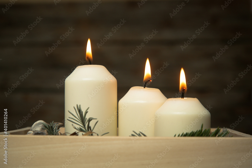 Wooden box christmas centerpiece. Simple and small home decoration with candles in wooden box.
Wooden box christmas centerpiece. Simple and small home decoration with candles in wooden box.