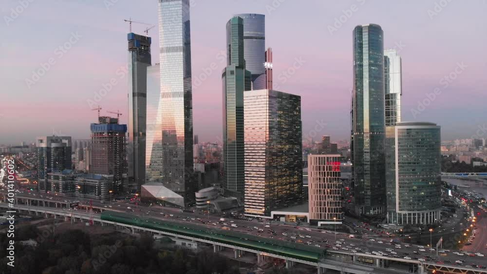 Aerial evening Metropolis Skyscrapers Glass towers of Moscow City Business Center. Moscow International Business Center as commercial district in Moscow at sunset seen by drone Aerial evening Metropolis Skyscrapers Glass towers of Moscow City Business Center. Moscow International Business Center as commercial district in Moscow at sunset seen by drone