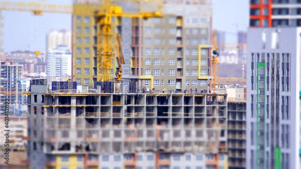 construction of the house with a crane and people construction of the house with a crane and people