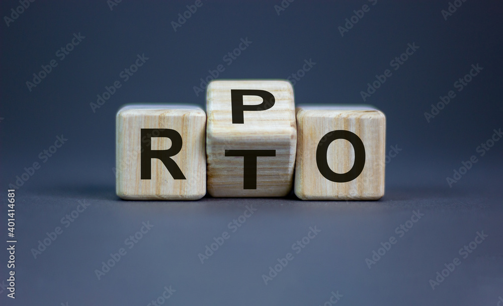 RPO vs RTO. Turned a cube and changed the word 'RTO - recovery time objective' to 'RPO - recovery point objective'. Business and RPO vs RTO concept. Beautiful grey background, copy space. RPO vs RTO. Turned a cube and changed the word 'RTO - recovery time objective' to 'RPO - recovery point objective'. Business and RPO vs RTO concept. Beautiful grey background, copy space.